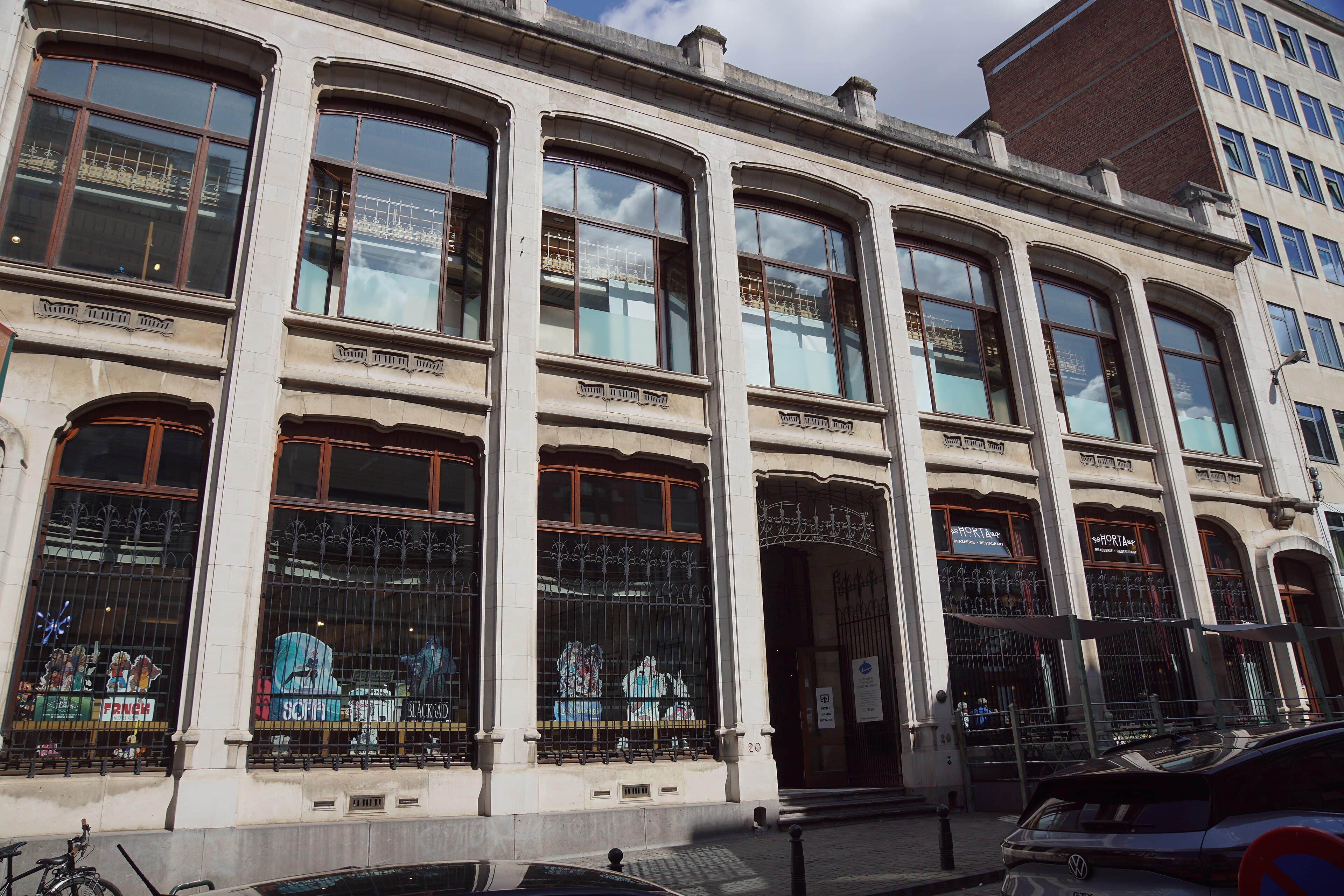 A large colourful comic-strip mural painted on the side of a Brussels building