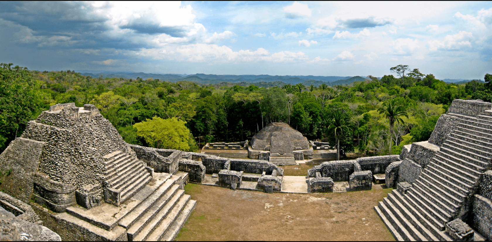 The tall stone pyramid of Caana rising above the jungle canopy at Caracol