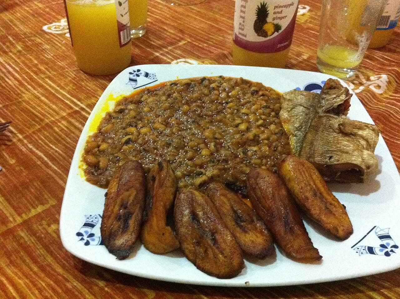 Slices of fried plantain golden and caramelised on a plate